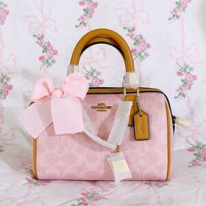 Coach Mini Rowan Crossbody Bag In Signature With Charms in Powder Pink
